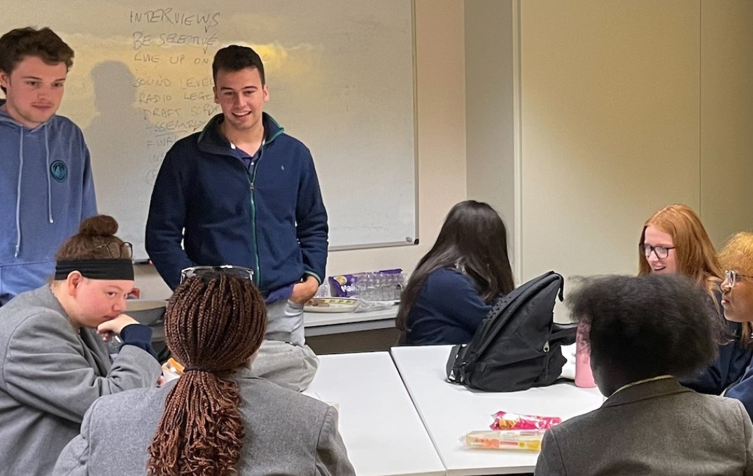 students talk with pupils