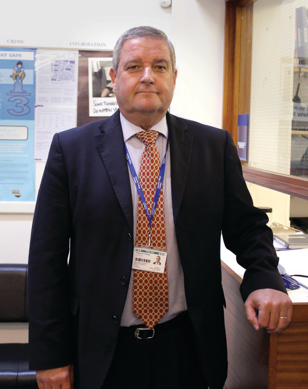 man in suit smiles at camera