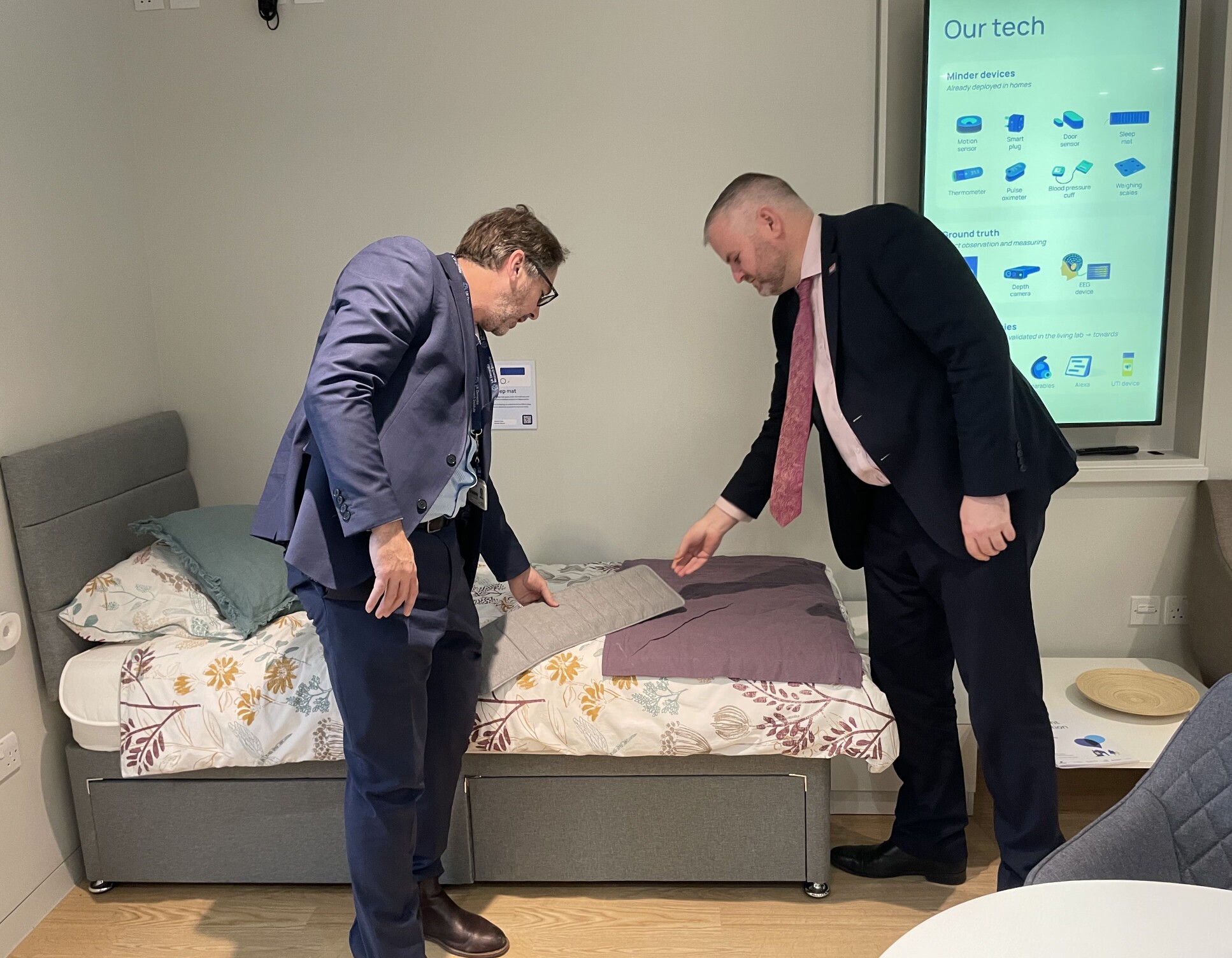 Professor Dave Sharp tours the Minister around the Living Lab and explains the sleep tracking mat to help diagnose dementia