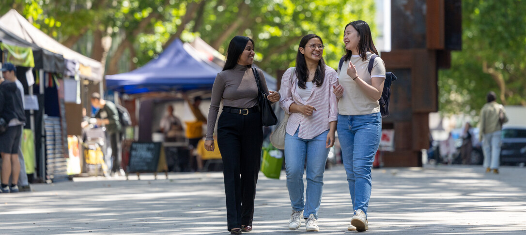 students having a conversation outdoors