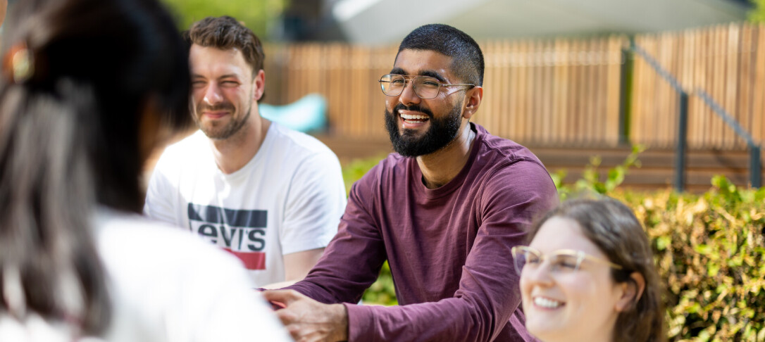students having a conversation outdoors