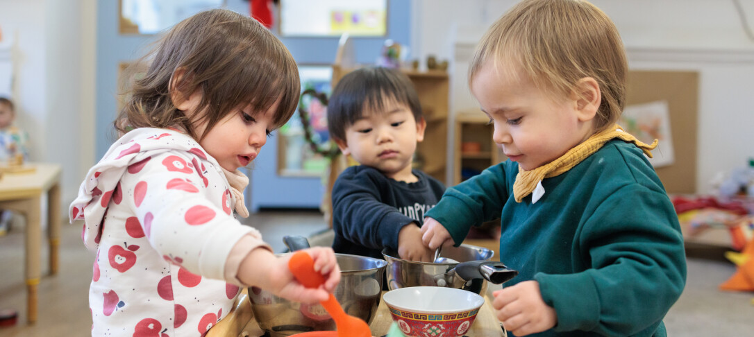3 children playing with pans