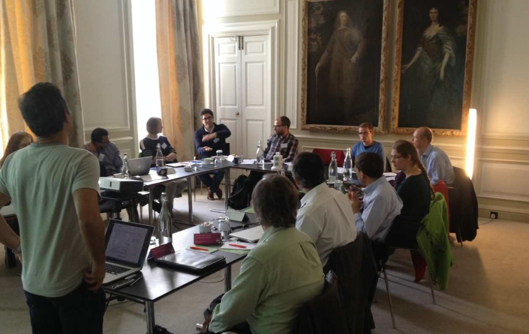 Delegates photographed during a presentation at Chicheley Hall at the inaugural meeting of the Red Lotus Project in 2016