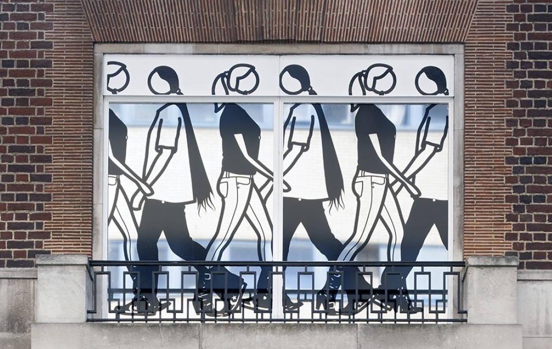 Julian Opie art of people in window at St Mary's