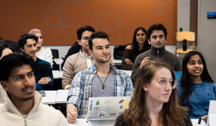Students facing forward  in rows in a classroom 