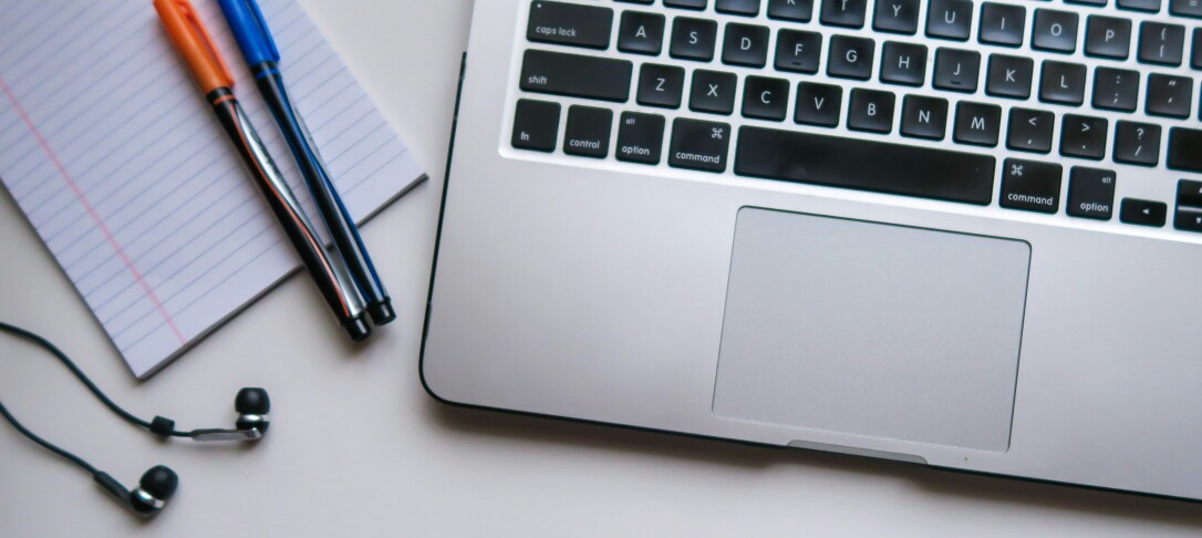 person typing on a laptop