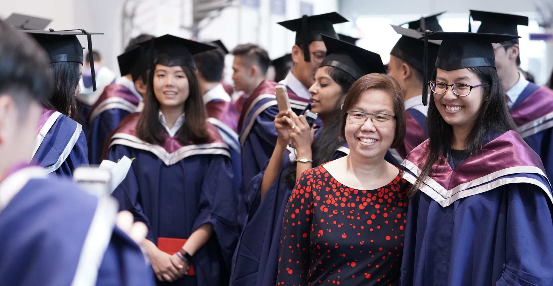 LKCMedicine graduate with family