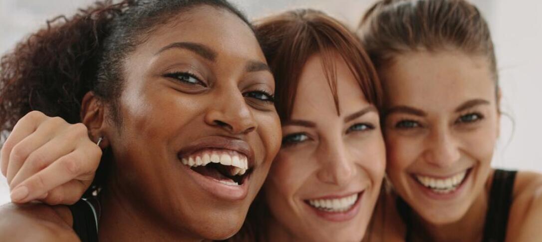 three women smiling together