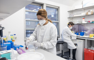 Photo from behind of ambulance driving down motorway