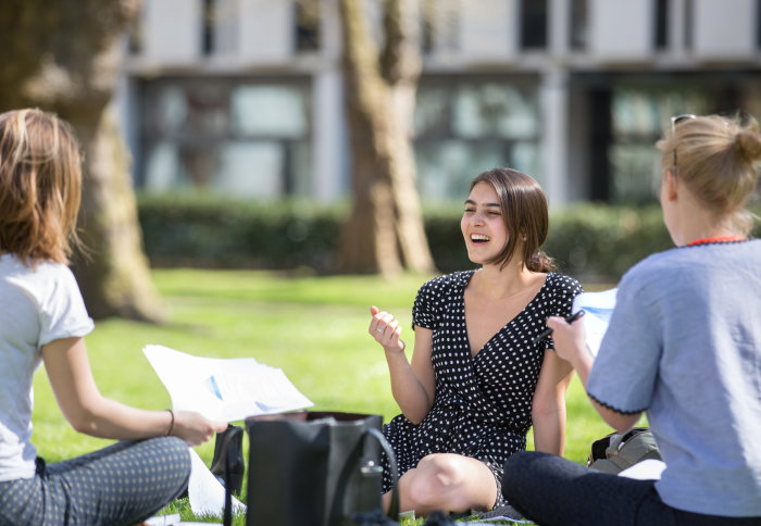 Students chat on Queen's Lawn