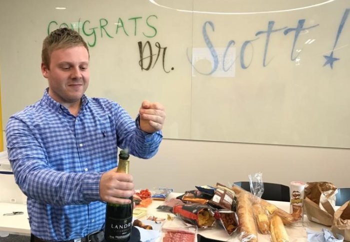Scott celebrating after his viva