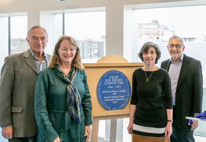 People and a plaque