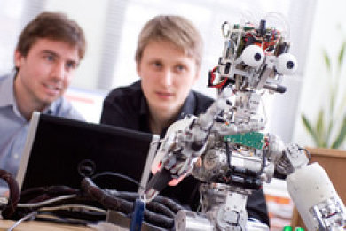 Researchers with a robot