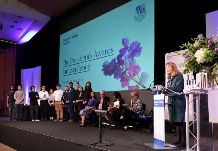 Students and staff on stage