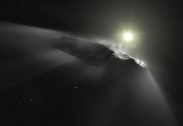 Sunlight glints off an asteroid in space