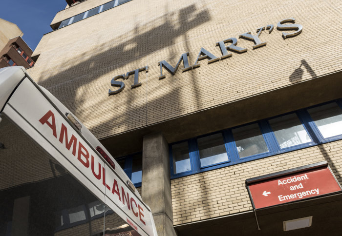 A photograph of St Mary's Hospital with an ambulance outside
