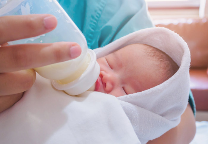 A baby drinking a bottle