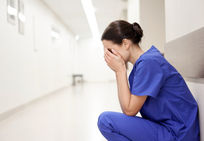 A doctor sitting in a corridor