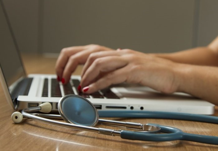 Doctor using laptop