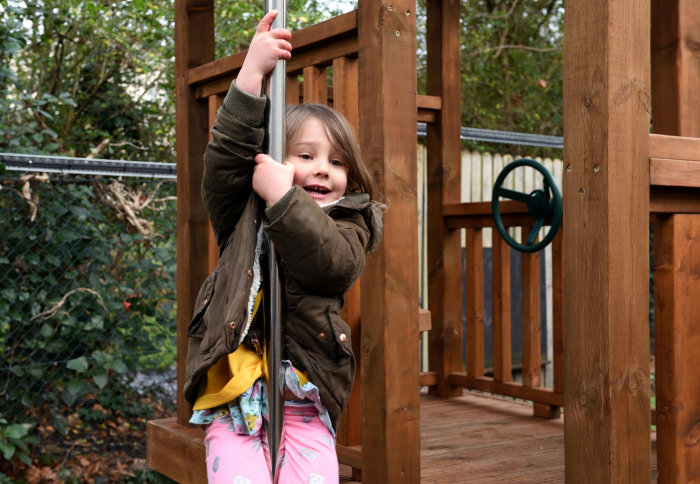 child on play equipment