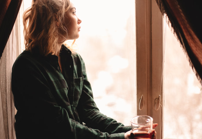 Woman looking out a window