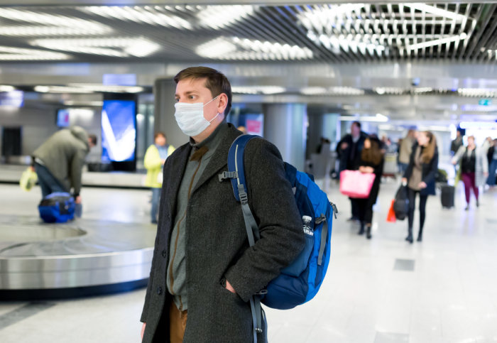 Man wearing a mask in an airport
