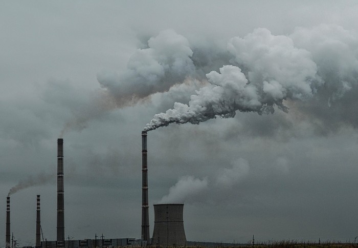 Smoke and carbon pollution being pumped into the atmosphere from a power plant
