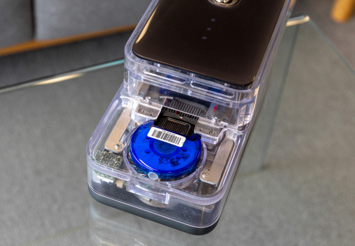 The blue circular CovidNudge cartridge inside the NudgeBox analyser