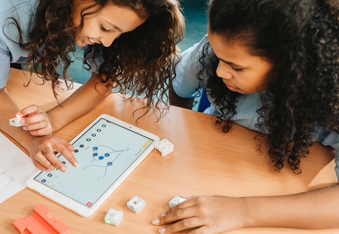 Two students using a tablet