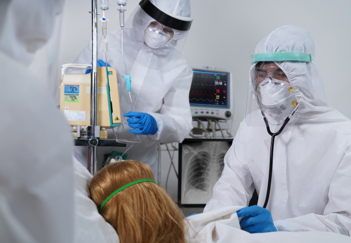 A patient and two doctors in a hospital