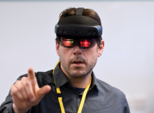 Man wearing and using HoloLens