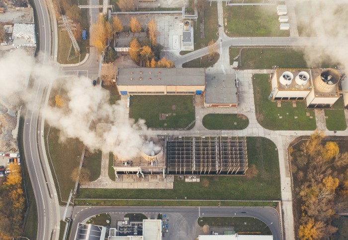 Image of industrial buildings emitting carbon dioxide