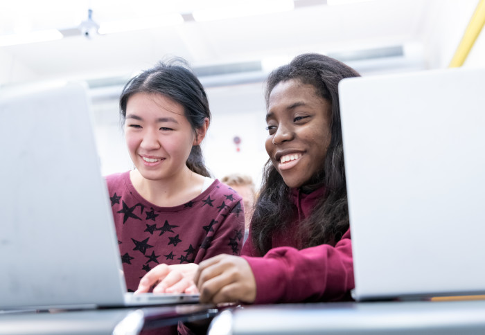 Image of students at a computer