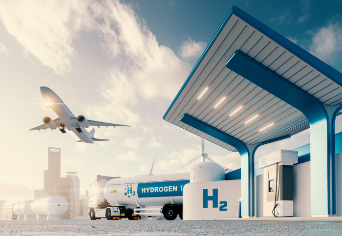 Illustration of a hydrogen station with a truck and a plane nearby