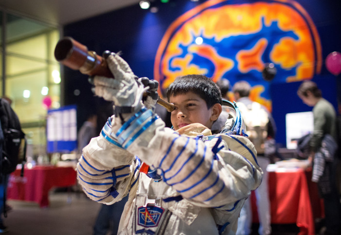 Student scientist in space suit