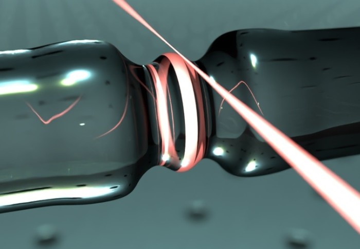 Illustration of red laser light in a tube