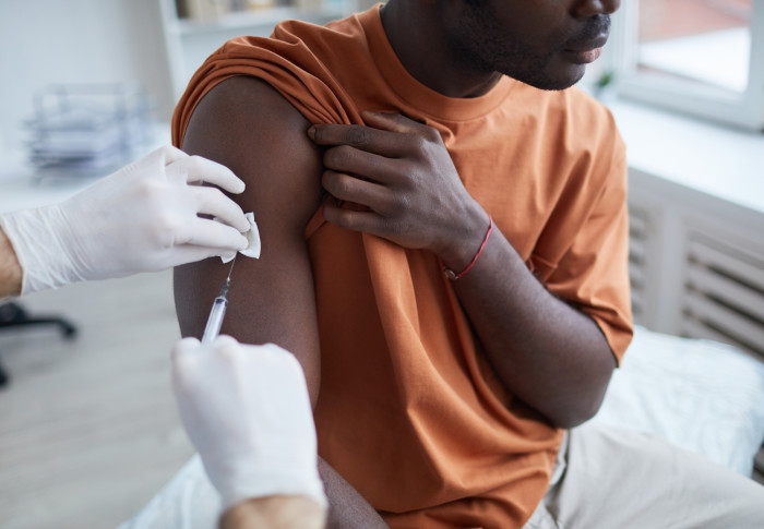 A man receives a COVID-19 vaccine