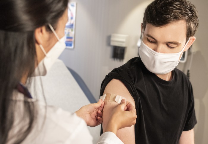 A young person receiving a vaccine