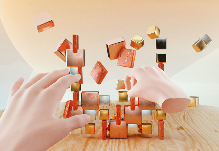 Mock up of a virtual reality experience, showing two disembodied virtual hands knocking down a pile of digitally rendered toy bricks