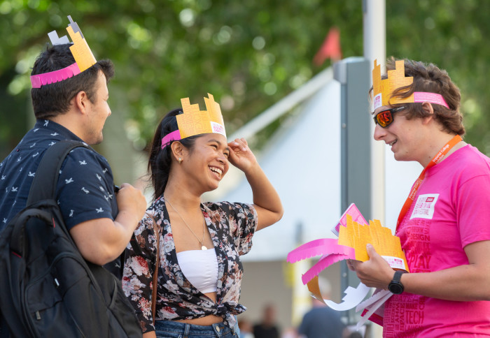Attendees of the Festival wearing cardboard hats