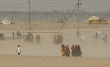 Indians brave the heat wave at the bank of Sangam during a hot summer day in Prayagraj, India.