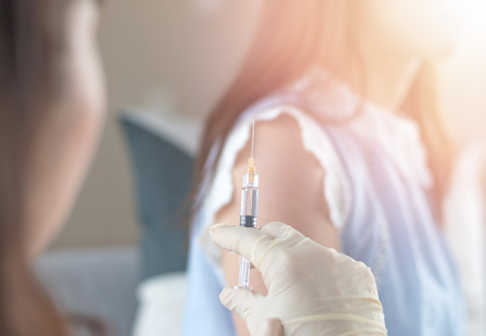 Women having vaccination