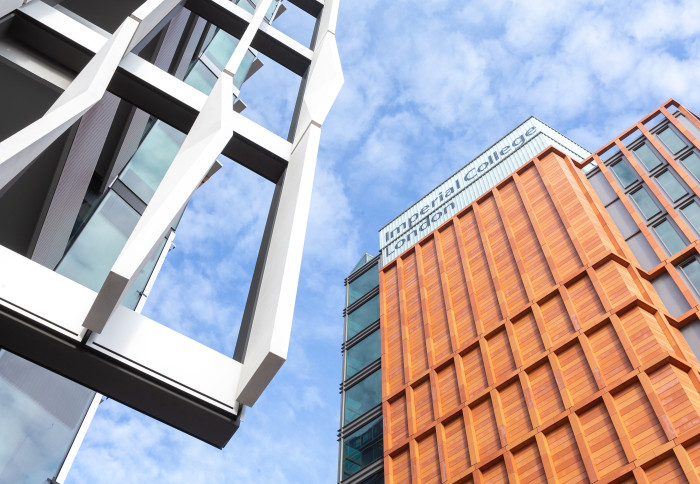 Close-up photo of some of the architecture on the new White City campus, including Imperial's logo