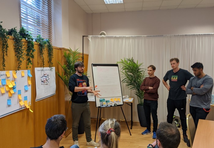 Students presenting to a panel of 3 judges