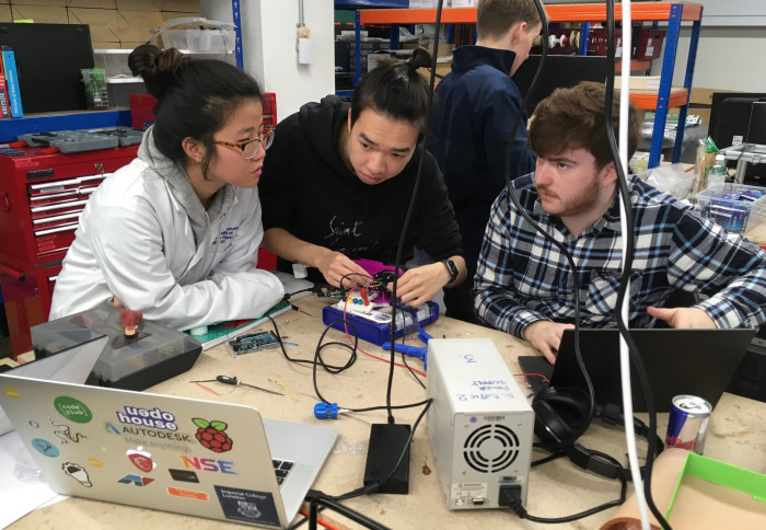 The students working on the robotic percussion prototype