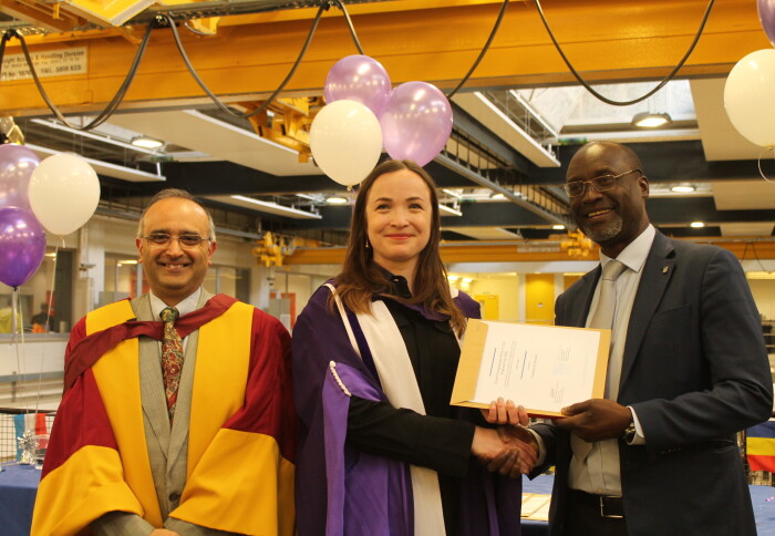 Professor Wadee and Professor Ochieng present Carolanne Vouriot with her award