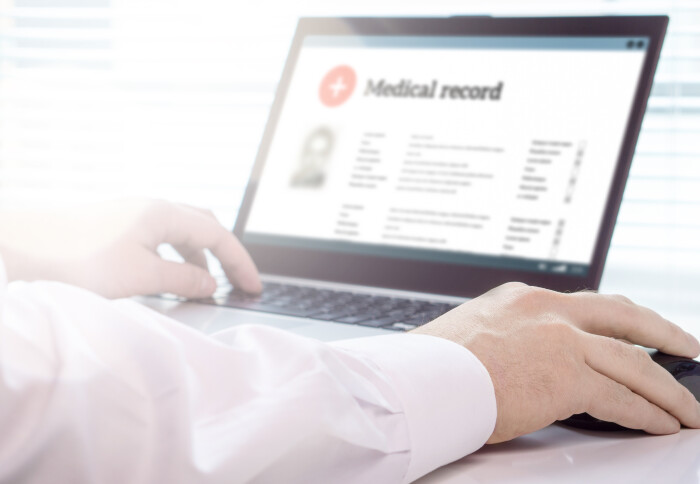 Doctor reading a digital medical record
