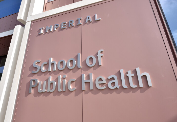 Photo: Sign on side of building in the sunshine reads Imperial School of Public Health