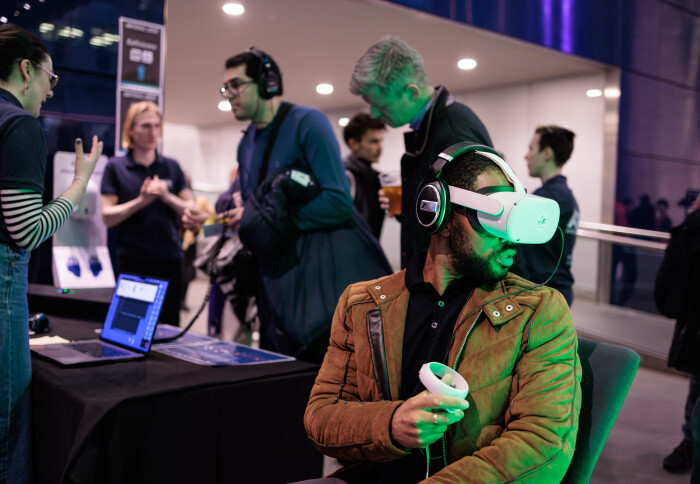 Visitor using VR headset at Imperial Lates: AI
