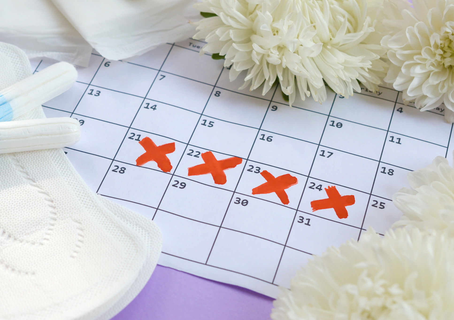 Sanitary products and calendar with red crosses on it